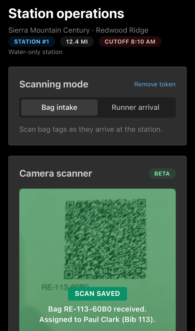 Volunteer scanning drop bags at an aid station